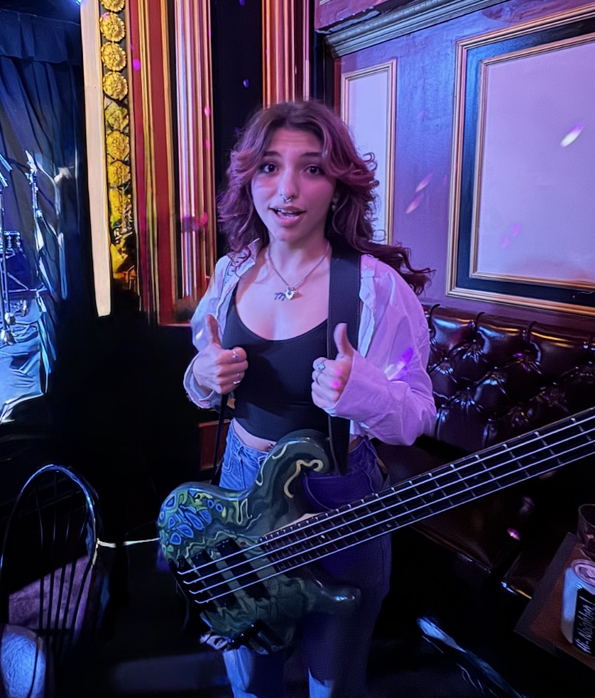 Adri with a bass guitar after the Triad Theater Show
