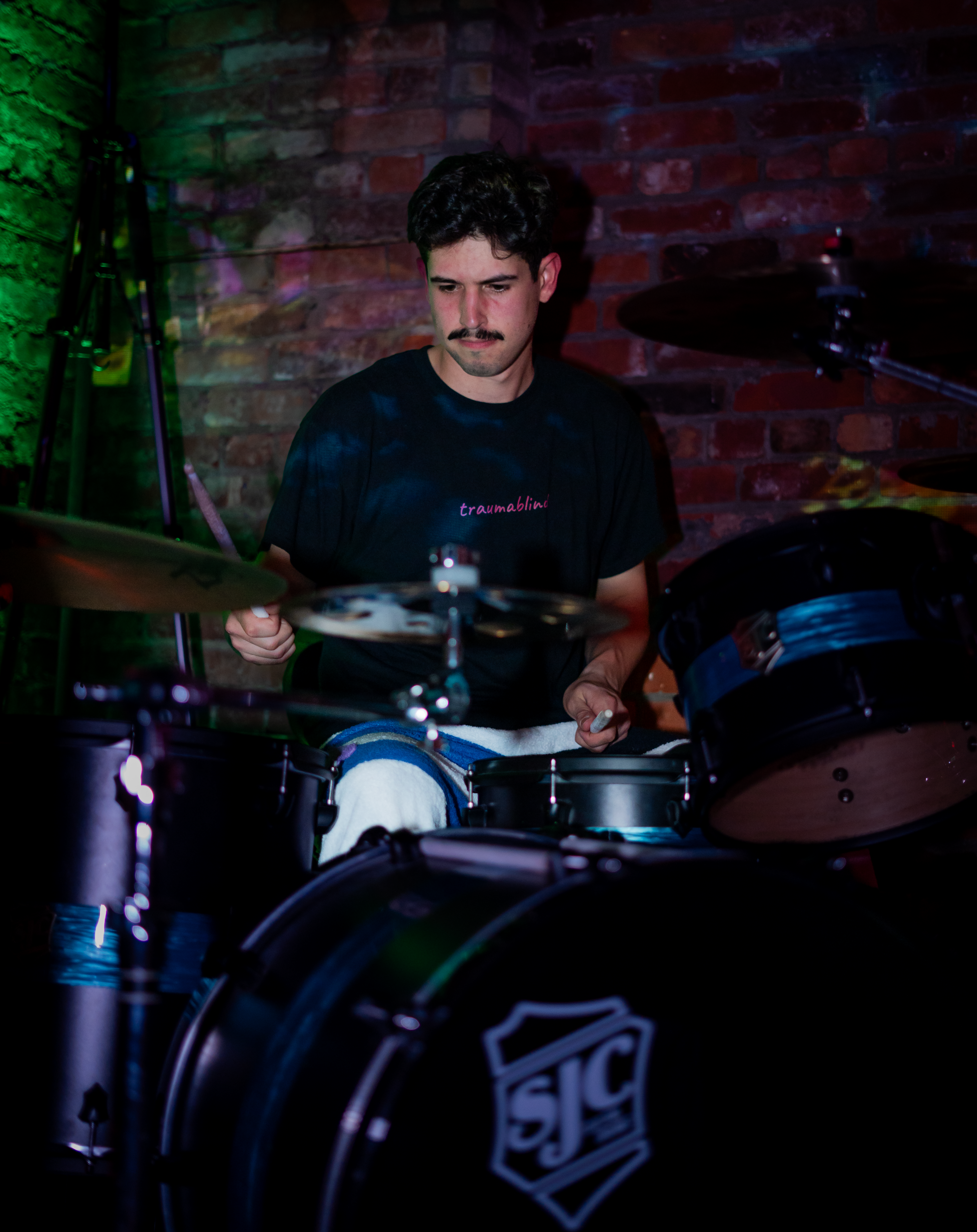 Louis Aurisy playing drums at Reason & Ruckus